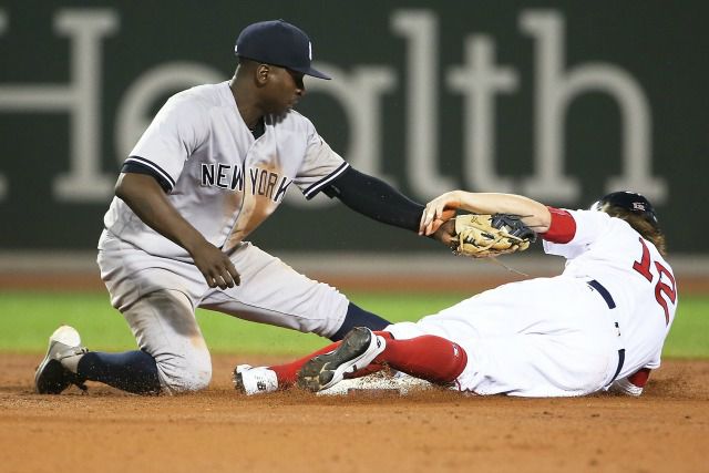 The Yankees and Red Sox involved in a close play at second base, much like how they're closely involved in trying to cheat each other